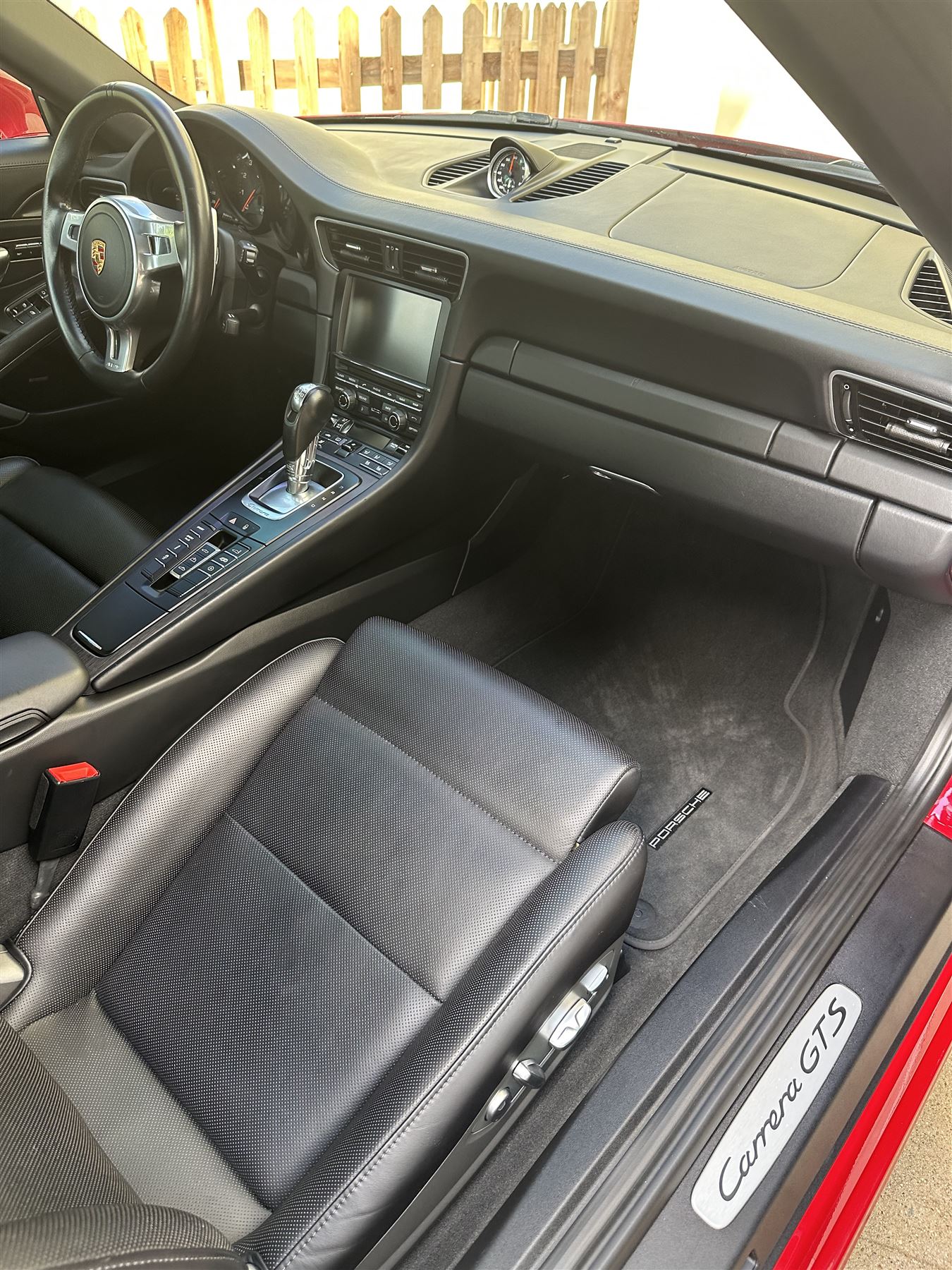 Spotless black leather interior of a Porsche Carrera GTS