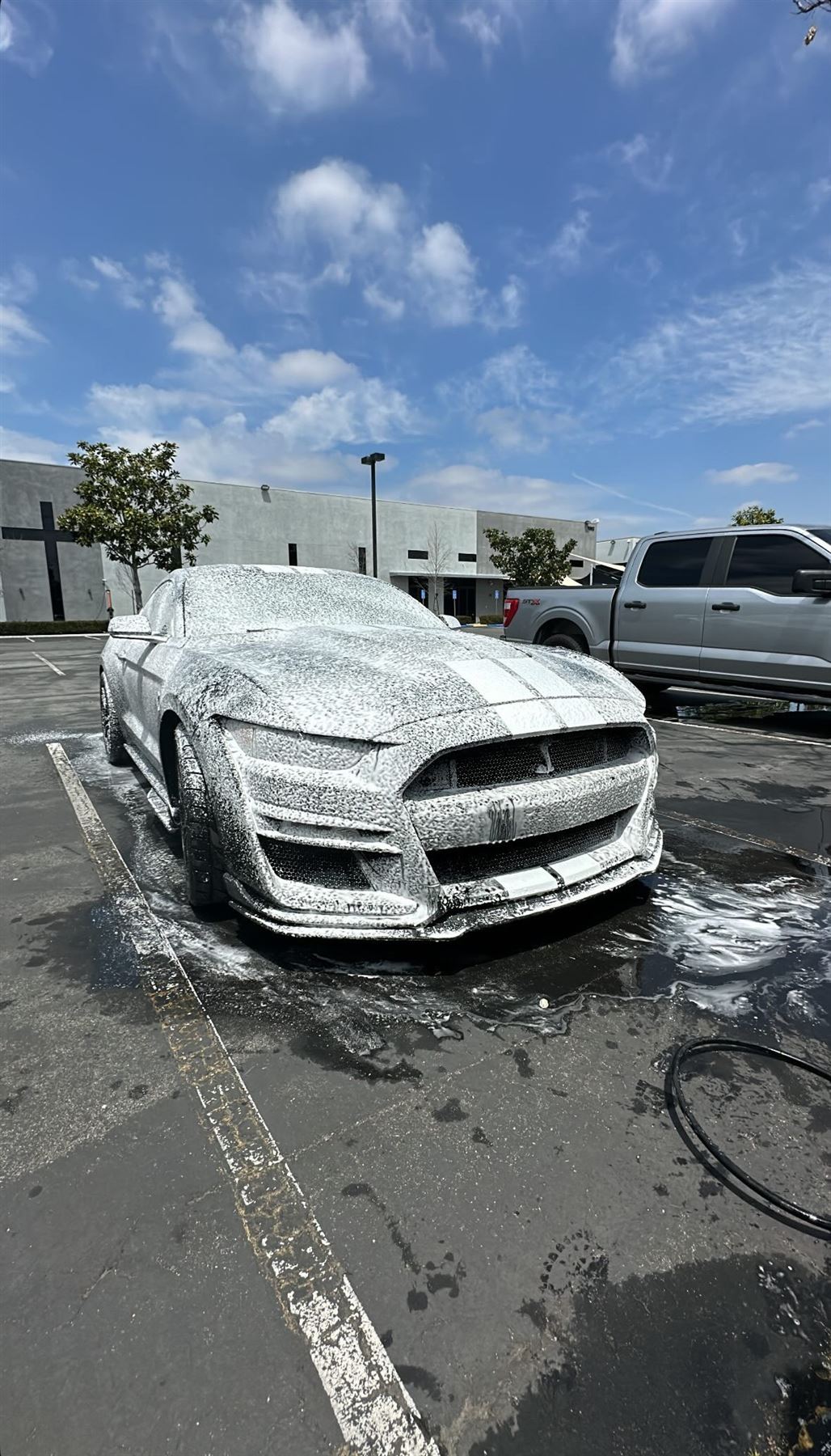 Shelby GT500 Mustang covered in foam during a wash
